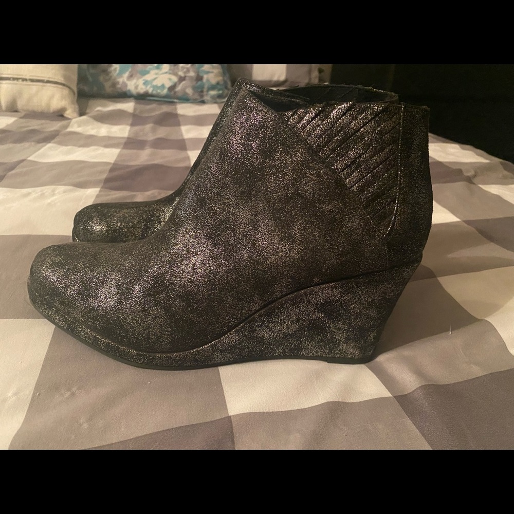Black and silver glitter brand new wedge booties. New,tags attached, size 9 1/2.